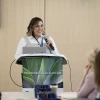 Adriana Maldonado speaks at podium 