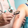 doctor examines skin